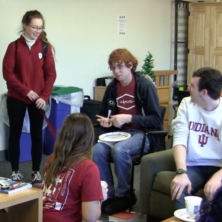 HRC residents enjoying pizza in a common lounge